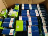 a box full of blue and green boxes of soap