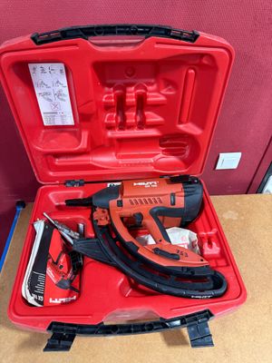 an image of a red tool case filled with tools on a table