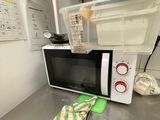 a microwave sitting on a counter in a kitchen