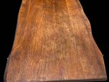 an image of a wooden table on wheels on a black background