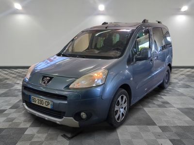 a picture of a blue van parked in a garage