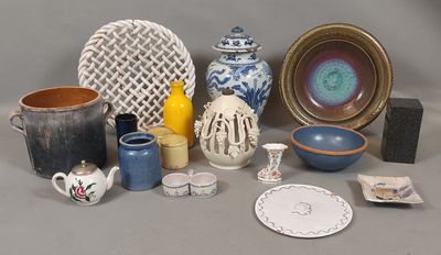 many different types of vases and bowls on the table