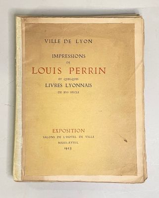an old book with a yellow cover sitting on top of a white table