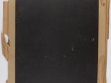 a piece of brown paper with a blackboard attached to it