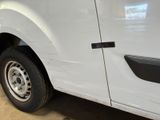a white truck that is parked in a garage