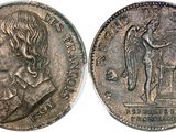 a close up of a coin with a man on it