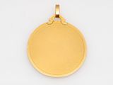a close up of a gold medal on a white background