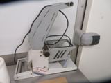 a machine that is sitting on a counter next to a toilet