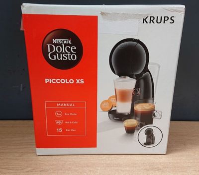the box of the coffee machine is sitting on the table