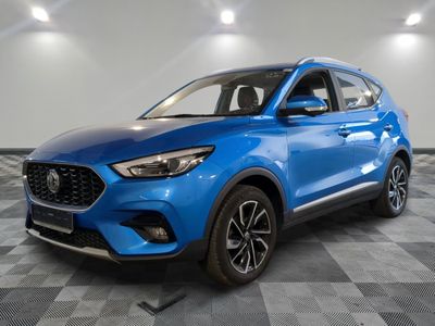 a blue 2020 hyundai tucson suv parked in a showroom