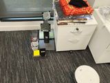 an image of a room that has a lot of clutter on the floor