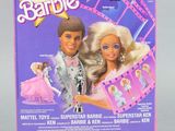 the box for the barbie doll is open and ready to be played