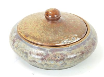 an image of a ceramic container with a wooden lid