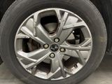 a close up view of a tire on a car