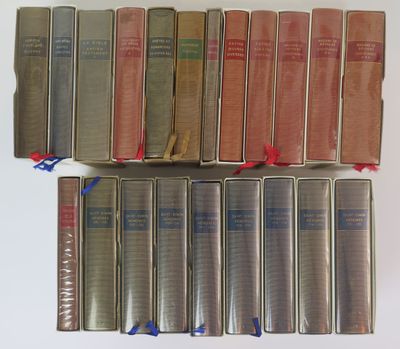a lot of books that are sitting on a table