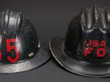 two fire hats with the numbers 35 and 35 on them