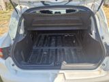 the back of a car with its trunk open and the back of the car with its trunk open
