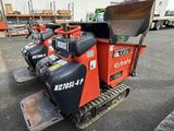 many different types of machines parked in a parking lot