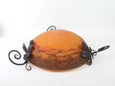 an orange and black object on a white surface