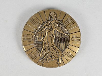 an image of a gold medal with a woman on it