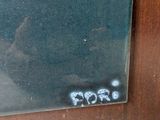 a picture of a mirror with graffiti on it