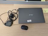 a laptop and a mouse on a table