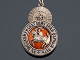 an image of a medal with a horse and rider on it