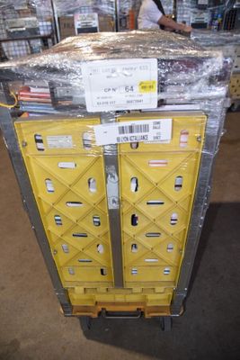 a pallet with a box on top of it in a warehouse