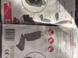 two packages of baby car seats on the ground