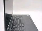 a laptop computer that is open on a white surface