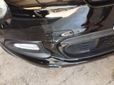 a close up of the front bumper of a black car