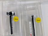 several different types of screws in plastic boxes on a white surface