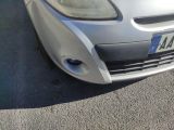 a silver car that is parked in a parking lot