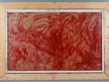 an image of a painting with red paint on a wall