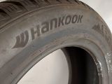 a close up of a tire on a white surface with the word hankkook written on it