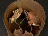 an old helmet with a broken shell inside of it