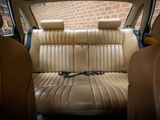 the back seat of a car with a remote control in it