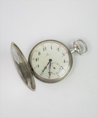 a pocket watch that is sitting on a table