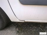 a close up of a white car with a flat tire