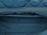 the inside of a blue purse with a zipper on it