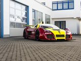 a red and yellow sports car parked in front of a building