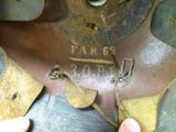 a close up of a person ' s hand holding a piece of metal