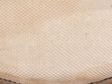 a close up of a chair with a cushion on it