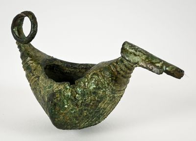 an image of a green vase with a handle on a white surface
