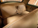 a seat in the back of a car with a window open