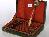 a box with a spoon and spoons inside of it