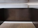 a close up view of a corner of a wooden table