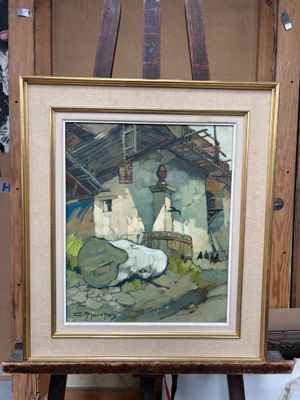 une image d'un tableau sur un chevalet dans une pièce