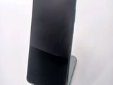 a cell phone that is sitting on top of a stand