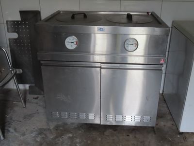 a stainless steel stove and a refrigerator in a kitchen